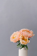 Close Up Of A Bouquet Of Peach Colored Peonies In Full Bloom.