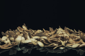 Leinwandbilder - Potato skins on a black background. Close up.