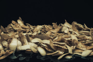 Leinwandbilder - Potato skins on a black background. Close up.