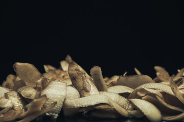 Leinwandbilder - Potato skins on a black background. Close up.