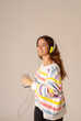© SB Arts Media - Pretty young teenager girl in headphones listening to music and