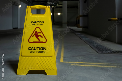Bright Yellow Sign With Red Icon Of Falling Man On Wet Floor Sign