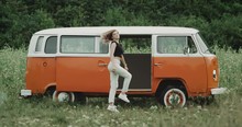 Beautiful Young Ladie Dacing In A Retro Van In The Middle Of Nature, Happy Smiling Faces.