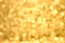 Golden Yellow Background With Abstract Blurred Highlights. Bokeh In Blur.