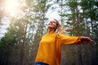 © StratfordProductions - Beautiful happy blonde young woman dancing in forest