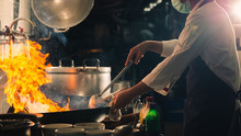 Chef stir fry in wok
