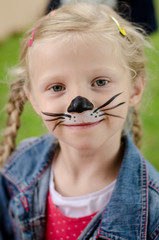 Wall Mural - smiling girl with face painting of mouse