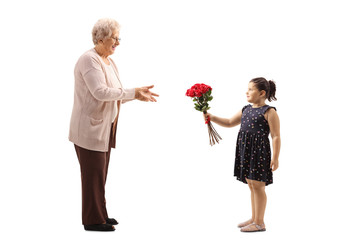 Poster - Little girl giving a bunch of red roses to a grandmother