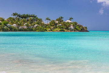 White sandy beach and turquoise waters on carebbian island of St. Maarten