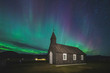 © Cavan Images - View of church with Aurora Borealis