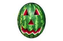 Isolated Watermelon With A Scary Smiling Face Like A Pumpkin For Halloween, Halloween Decor Of Carved Watermelon In The Shape Of The Horror Bloody Head On White Background, Isolate