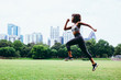 © Gerald Carter/Creative Flame - Young woman exercising in city park