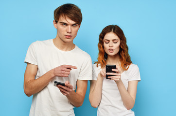 Young couple with phones