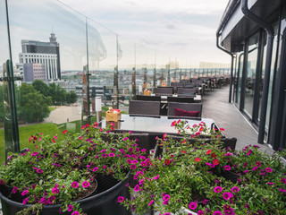 Sky cafe on the roof terrace with view of modern city