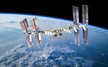 ISS Station On Orbit Of The Earth Planet. Elements Of This Image Furnished By NASA