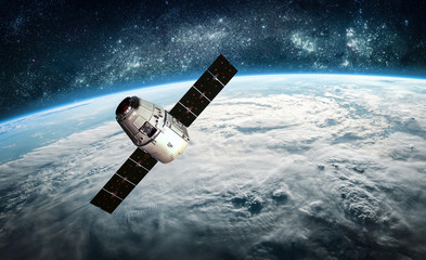 Leinwandbilder - Cargo spacecraft on orbit of the Earth planet. Milky way on background. Space ship. Elements of this image furnished by NASA