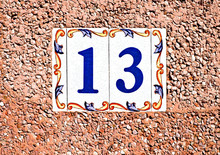 Unlucky Lucky Number Thirteen / 13 In Decorative Tiles On A Pink Surface.