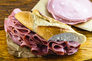 Wall Mural - Bread sandwich with bologna. Typical Brazilian sandwich found in the municipal market of the city of São Paulo.