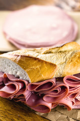 Wall Mural - Bread sandwich with bologna. Typical Brazilian sandwich found in the municipal market of the city of São Paulo.