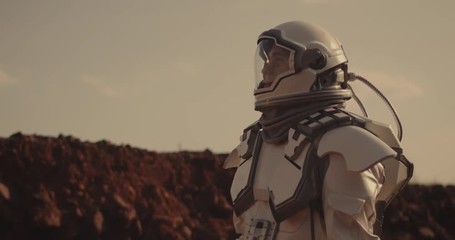 Wall Mural - Astronaut looking around on Mars