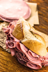 Wall Mural - Sandwich with bologna bread. Snack typical of Brazil. Homemade bread snack with bologna. Fast food.