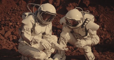 Wall Mural - Astronauts collecting rock samples on Mars