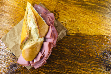 Wall Mural - bread with mortadella typical of Brazil. Bakery snack. Snack made at the municipal market of the city of São Paulo.