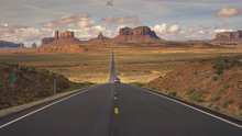 Silver Car On Highway 163 At Monument Valley
