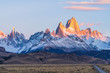 Beautiful dawn golden orange light of sun rise over the Fitz Roy and Cerro Torre peak snow mountain in the morning beside the route 40 road from El Calafate to El Chalten, south Patagonia, Argentina