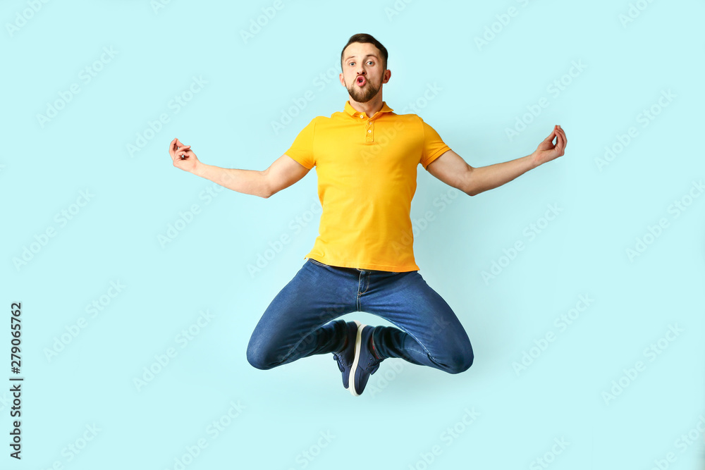 Funny jumping man on color background