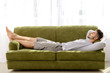 © Pixel-Shot - Handsome man sleeping on sofa at home