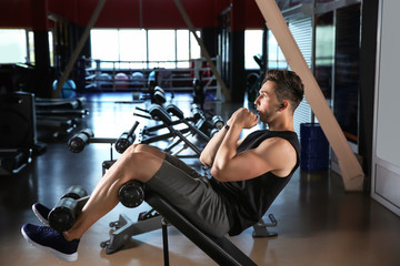 Sticker - Sporty young man training in gym