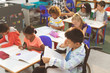 © WavebreakMediaMicro - School kids studying in the classroom at school