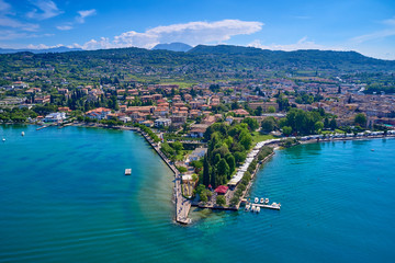 Aerial photography with drone. Beautiful coastline. In the city of Bardolino, Lake Garda, Italy.