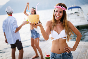 Group of friends enjoy on the beach on summer vacation