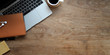 © bongkarn - Overhead shot of wooden desk with laptop