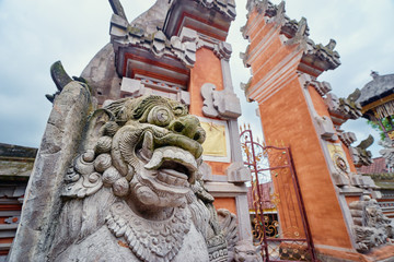 Wall Mural - Stone dragons sculptures on balinese hindu temple.