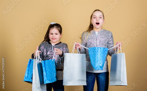 Girls Sisters Friends With Shopping Bags Beige Background Shopping And Purchase Black Friday Sale And Discount Shopping Day Children Hold Bunch Packages Kids Fashion Expect More Pay Less Stock Photo Adobe