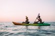active lifestyle, husband and wife play sports early in the morning. Kayaking