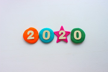 2020 background .The concept of the new 2020. New year with colorful numbers 2020 on white background. Christmas card, congratulations. Copy space.