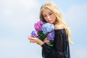 Girl tender fashion model hold hydrangea flowers bouquet. Meet spring with fresh bouquet. Flowers tender fragrance. Bouquet for girlfriend. Fashion and beauty industry. Celebrate spring with bouquet