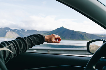 adventure mood, wanderlust nomad travel blogger lifestyle concept. woman holds out hand out of windo