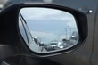 © wachira - blurred of traffic jam in wing mirror of car on the road in summer day
