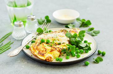 Wall Mural - Breakfast. Frittata Italian omelet with green peas and salad.