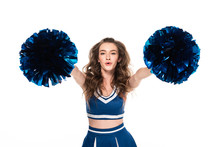 Excited Cheerleader Girl In Blue Uniform Dancing With Pompoms Isolated On White
