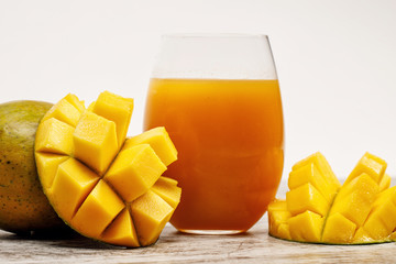 Wall Mural - ripe juicy mango and fresh mango juice