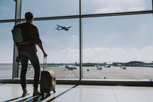 Man Is Watching Plane Flying From Airport