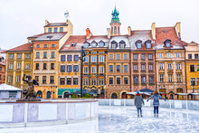Two Girls Skate On A Skating Rink In The Old Town Square In Warsaw On The Eve Of Christmas, Poland