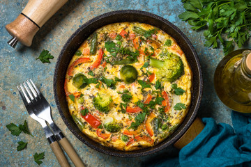 Frittata with fresh vegetables in the skillet.