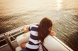 © Cavan for Adobe - Girl looking at lake